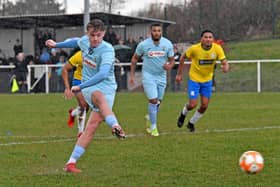 Caine Elliott opened the scoring from the penalty spot but Rugby Town could only manage a 4-4 draw at GNG Oadby Town last weekend. Picture by Martin Pulley