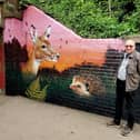 The Mayor of Warwick, Cllr David Skinner, next to one of the new mural sections.