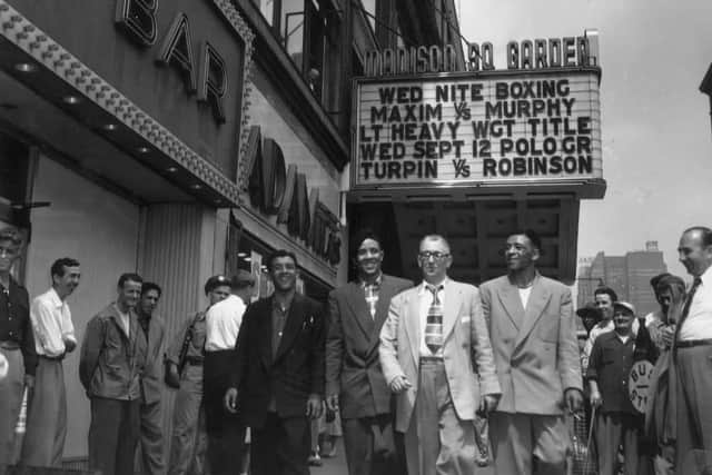 The Turpins 20th August 1951: British boxer and World Middleweight Champion Randolph Turpin, with his manager and brothers, Dick and Jackie, in New York. (Photo by Keystone/Getty Images)