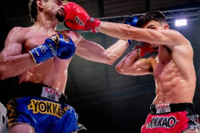 George Mouzakitis  (right) Damien Alamos trade blows during the epic fight. Picture supplied.
