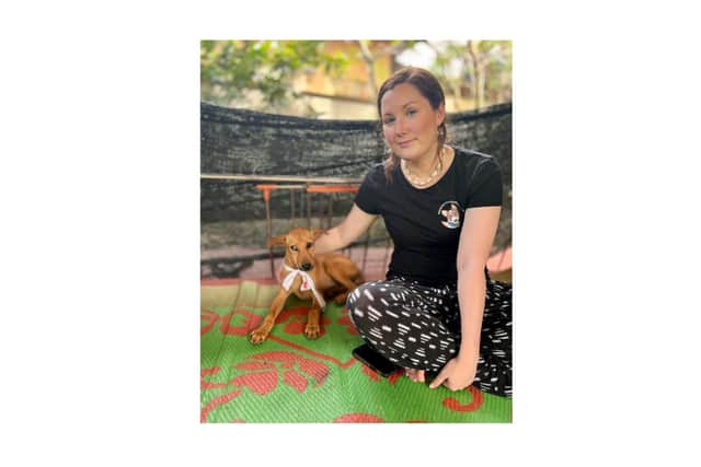 Laura Kearns, trustee of Lucas Helps Dogs, with one of the rescued animals. Picture supplied.