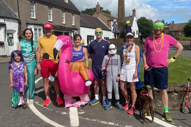 Sophie Knee-Higgins and her team of runners ran through Kineton dressed as an inflatable flamingo, Forest Gump, Princess Jasmine and Mr Motivator.