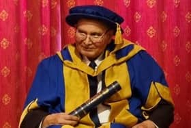 Dr Shera, having just been presented with his doctorate.