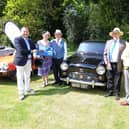 Mr Costa presents winners Mr and Mrs Maruda with the ‘Best in Show’ prize (left), alongside club president Roger Rose (right).