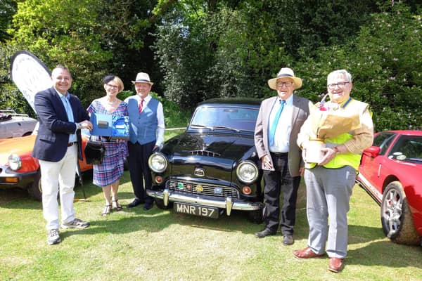Mr Costa presents winners Mr and Mrs Maruda with the ‘Best in Show’ prize (left), alongside club president Roger Rose (right).
