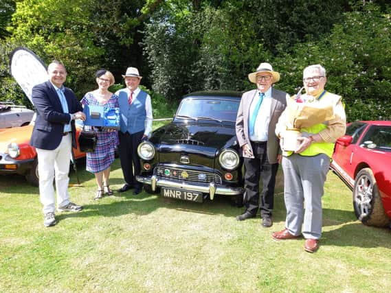 Mr Costa presents winners Mr and Mrs Maruda with the ‘Best in Show’ prize (left), alongside club president Roger Rose (right).