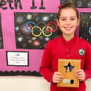Eight-year-old Miki Baker of Coten End Primary School in Warwick, has won a prize in a writing competition. Photo supplied