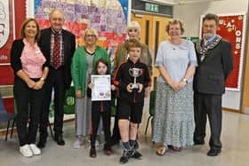 Katie Gane (Head Teacher) , Richard Kenyon (Chairman KiB), Pat Cockell (KiB), Caroline Barker (KiB), Veronica Leary (teacher) and Alan Chalmers (Kenilworth Mayor) – in the foreground members of the gardening club. Picture supplied.