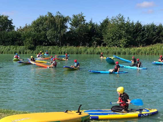 Students give paddle boarding a try!