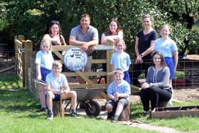 Caption: (l-r) Forest School teacher Lil Ellis, PB Forestry and Landscaping's Phil Bett, school head Catherine Burch, Kirsty Maclean from the PTA, The Wigley Group's Jess Wood, with children