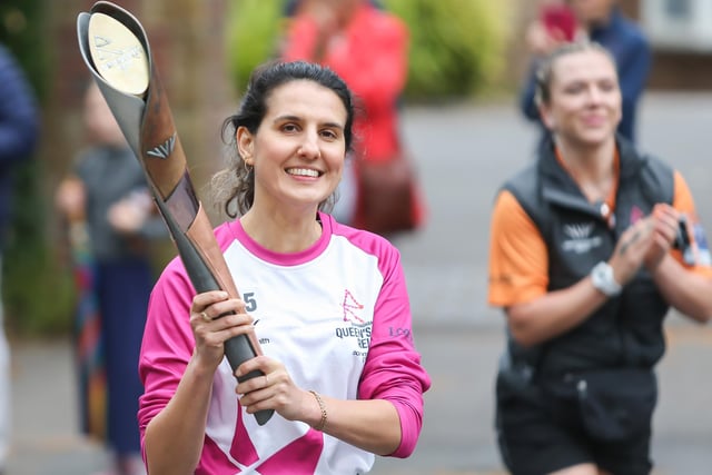 Batonbearer Ania Kocznur holds the Queen's Baton during the Birmingham 2022 Queen's Baton Relay on a visit to Kenilworth on July 22 (Photo by Nick England/Getty Images for Birmingham 2022 Queen's Baton Relay)