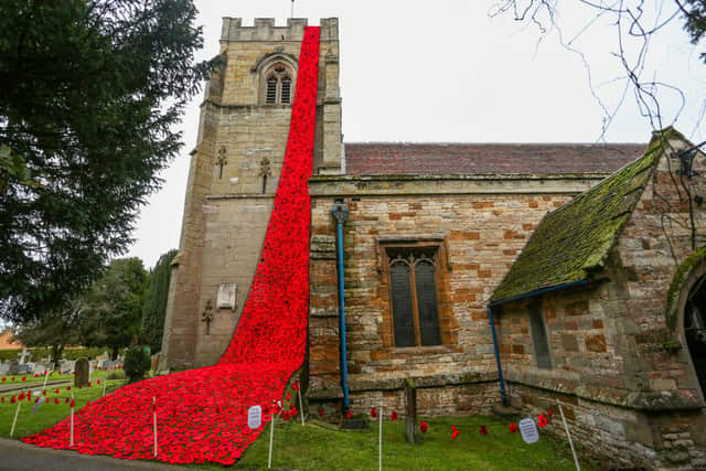 The poppy cascade outside St Peters Church in Wellesbourne (Joseph Walshe / SWNS)