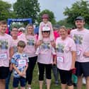Ryan Clarke (pictured right) will be taking on the TCS London Marathon in memory of his second cousin, Neive (pictured on her auntie’s shoulders above). Photo supplied