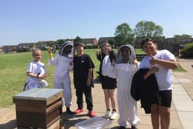 Year 4 pupils at  St Margaret’s C of E Junior school in Whitnash learn about beekeeping. Picture supplied.