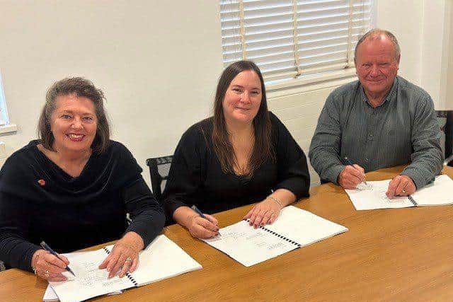 Signing contracts: Chief Exec Lorraine Collis, Head of Ops Louise O'Sullivan & Chairman Jimmy Miller