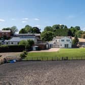 A view of the home and paddock.