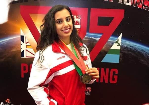 Warwick athlete Karenjeet Kaur Bains when she was crowned Commonwealth women’s junior under-63kg champion in St Johns, Canada in 2019. Photo supplied to the Courier in 2019