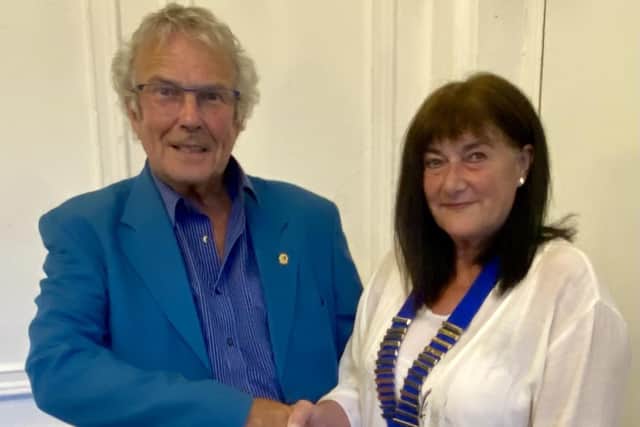 Outgoing President Neil Chisholm handing over his chain of office to incoming President Angela Watson-Bell. Photo supplied