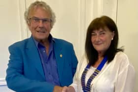 Outgoing President Neil Chisholm handing over his chain of office to incoming President Angela Watson-Bell. Photo supplied