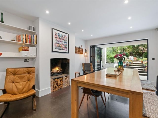 The dining/family room which leads to the patioed area. Photo by Fine and Country