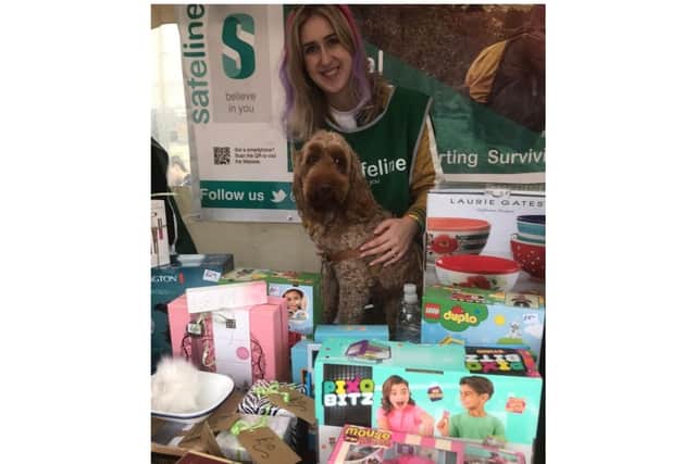 Becky Noonan from Bericote and her dog Luna at the Safeline stall. Photo supplied by Safeline staff and volunteers