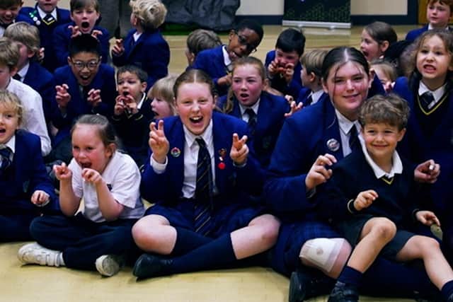 Reggie the animatronic T-Rex with primary school pupils