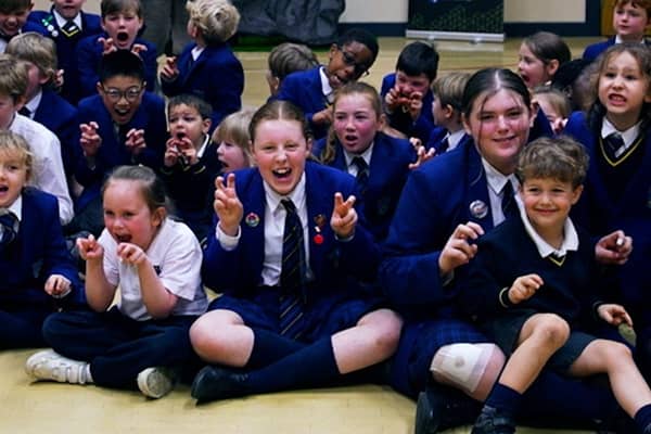 Reggie the animatronic T-Rex with primary school pupils