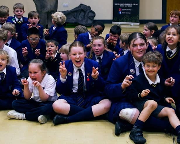 Reggie the animatronic T-Rex with primary school pupils