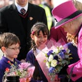 Vinitaraj Aulak presents a bouquet of flowers to Queen Elizabeth II during the event to officially open the Warwickshire Justice Centre in Leamington in 2011. This photo was among the many captured from the event by former Leamington Courier photographer Jass Lall.