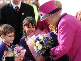 Vinitaraj Aulak presents a bouquet of flowers to Queen Elizabeth II during the event to officially open the Warwickshire Justice Centre in Leamington in 2011. This photo was among the many captured from the event by former Leamington Courier photographer Jass Lall.