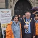 Leamington Mayor Councillor Alan Boad with the women of The Outreach Langar project outside All Saints' parish church in the town. Picture supplied.
