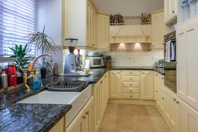 The kitchen and breakfast room includes an oil fired aga.