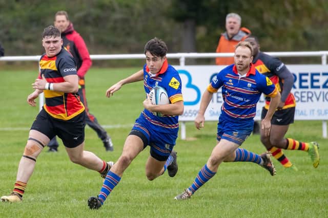 Leamington fly-half, Louis Vaughan, on his way to scoring. Photo by Ken Pinfold.