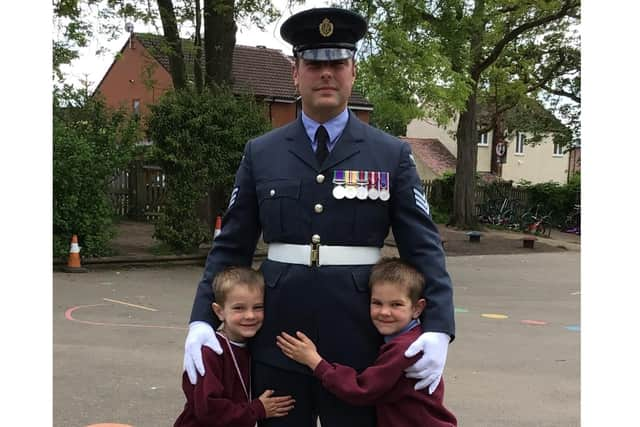 Sergeant Sean Pellington with his sons, Finley (6) and George (5) who both attend Emscote Infant School. Photo supplied