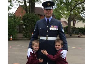 Sergeant Sean Pellington with his sons, Finley (6) and George (5) who both attend Emscote Infant School. Photo supplied