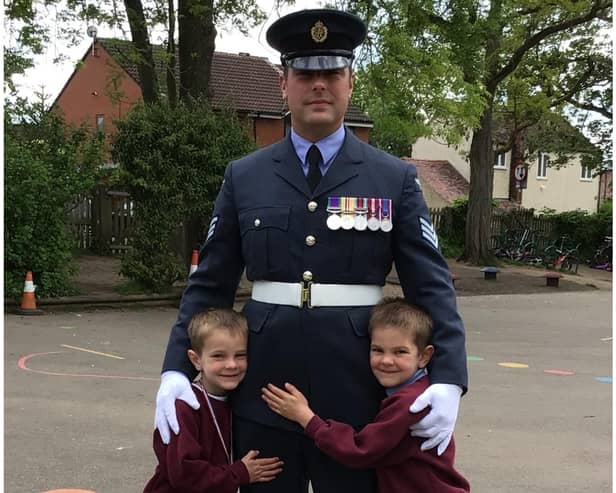 Sergeant Sean Pellington with his sons, Finley (6) and George (5) who both attend Emscote Infant School. Photo supplied