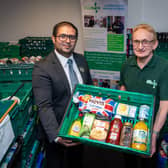Barratt Homes’ Sales Adviser, Hassan Ali – based at the nearby Aston Grange development in Upper Lighthorne – visited Warwick District Foodbank to learn how the donation will make a difference to the charity.  Photo shows Hassan Ali with Andy Bower, Operations Manager at Warwick District Foodbank. Photo by Mike Sewell