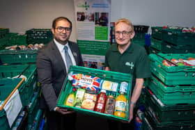 Barratt Homes’ Sales Adviser, Hassan Ali – based at the nearby Aston Grange development in Upper Lighthorne – visited Warwick District Foodbank to learn how the donation will make a difference to the charity.  Photo shows Hassan Ali with Andy Bower, Operations Manager at Warwick District Foodbank. Photo by Mike Sewell