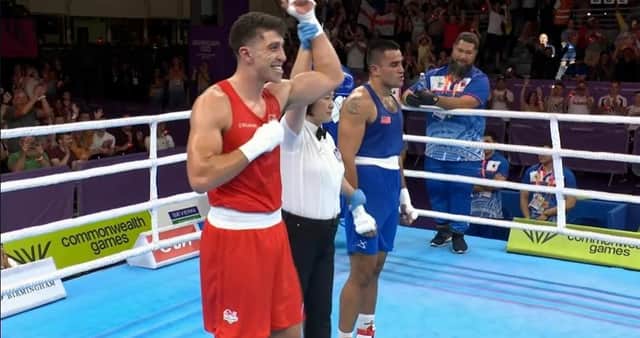 Lewis Williams is announced as the winner of the boxing heavyweight gold medal match at the Birmingham 2022 Commonwealth Games. Credit: BBC.