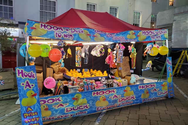 Stalls, entertainments and rides lined the town centre for the annual fair. Photo by Geoff Ousbey
