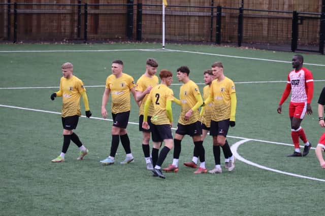 Racing Warwick celebrate their second goal.