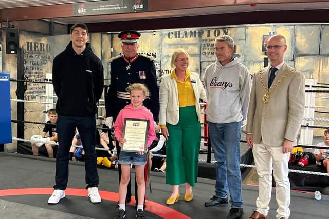 Ivie Williams receives her award from Lord Lt Tim Cox, Warks Deputy Police & Crime Commissioner Emma Daniell, WDC Cllr Rob Margrave & Lewis Williams.