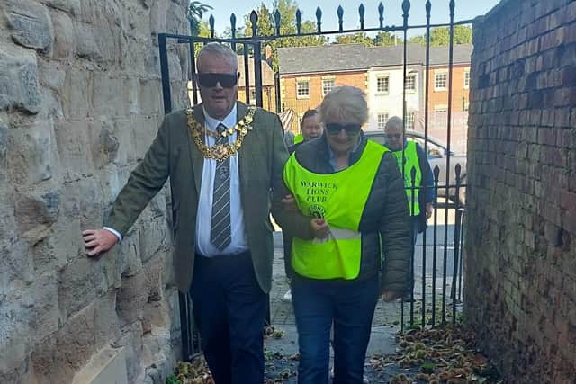 The Mayor of Warwick, Cllr Simon Pargeter navigating the town wearing visual impairing glasses. Photo by the Mayor of Warwick