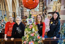 Slimming World members with their tree at St Andrew's Church.