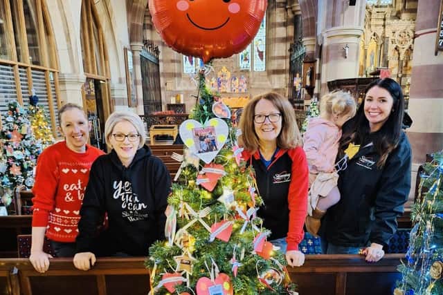 Slimming World members with their tree at St Andrew's Church.