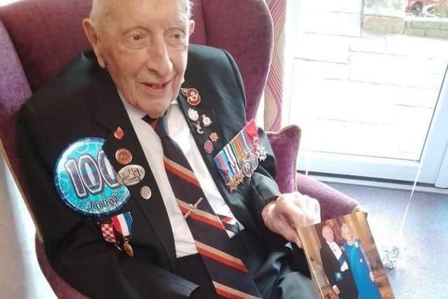 Reg Charles on his 100th birthday with his card from King Charles III
