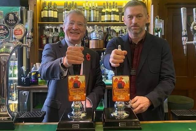 MP Mark Pawsey and Mark O’Neill in the Strangers' Bar pulling pints of Haystack Pale Ale.