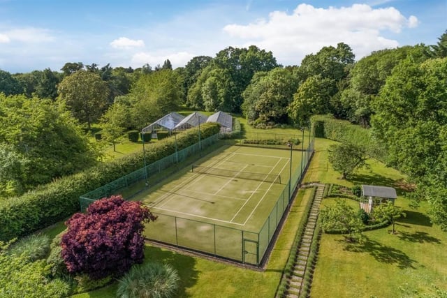 The property also comes with its own tennis courts which have flood lights and are made from artificial grass. Photo by Fine and Country