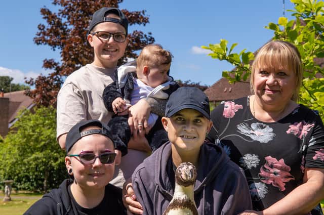 Jenny with her mum, friends and one of the penguins. Photo supplied