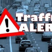 An overturned cement mixer is causing traffic delays in south Warwickshire.